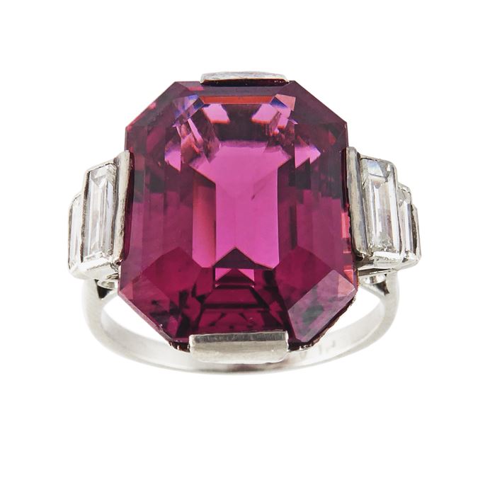 Art Deco mauve tourmaline and diamond dress ring, c.1925, the cut-corner rectangular tourmaline of step cut, the pinkish-brownish purple described as &#39;old mauve&#39;, approximately 7.75ct, | MasterArt